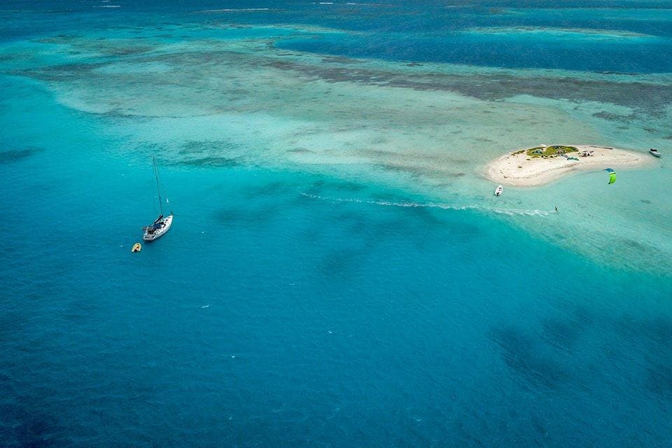 Sailing in coral archipelago Los Roques